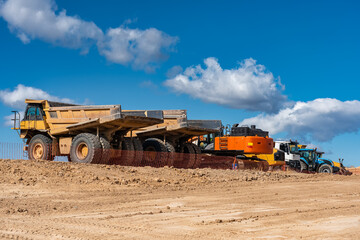 Large earth transport trucks for construction sites,
