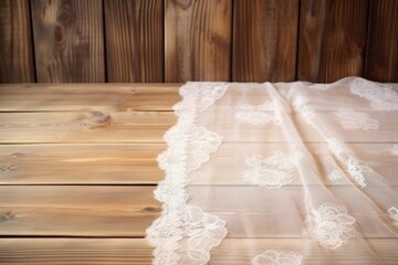 a lace cloth over a wood surface