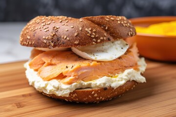 close-up of salmon on a bagel with cream cheese