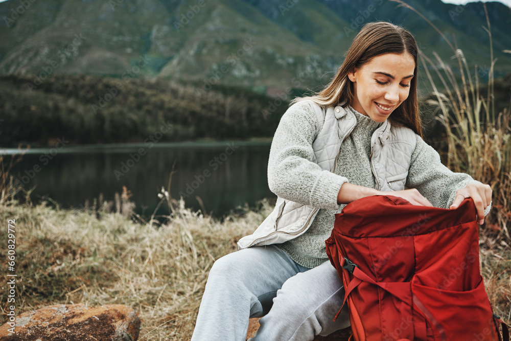 Sticker Nature, backpack and young woman hiking on a mountain for adventure, weekend trip or vacation. Happy, bag and female person from Canada trekking and camping in an outdoor forest or woods for holiday.