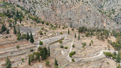 Fototapeta na wymiar Delphi, Greece. Ruins of the ancient city of Delphi. Sunny weather, Summer, Aerial View