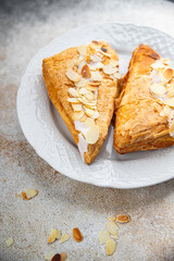 sweet almond triangle cake cream puff pastry dessert eating cooking appetizer meal food snack on the table copy space food background rustic top view