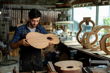 Luthier Taps Acoustic Guitar Wood to Check Sound Quality