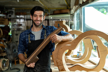 Acoustic Guitar Luthier Smiling in Workshop Portrait