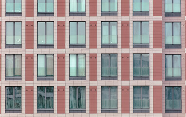 Fototapeta premium The walls of a multi-story building as a background. Texture