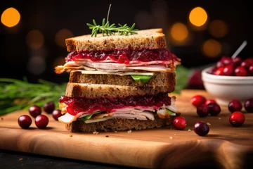 Deurstickers rye bread sandwich with turkey and cranberry sauce, holiday theme © altitudevisual