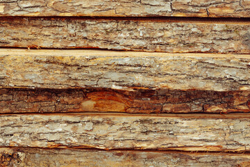 Background from large stacked wooden boards close up