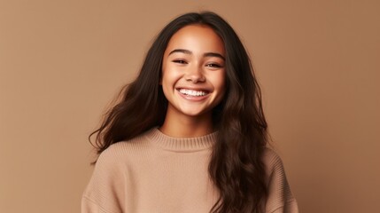 Fototapeta premium A beaming teen girl takes center stage against a well-lit studio background, her joyful expression evoking a sense of youthful energy.
