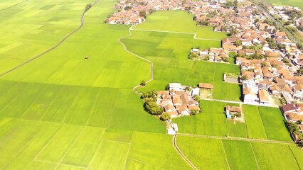 Aerial Drone Footage. Aerial Drone view video landscape view of densely populated residential areas in the middle of agricultural fields, Cikancung - Bandung, Indonesia. 4k Resolution Video