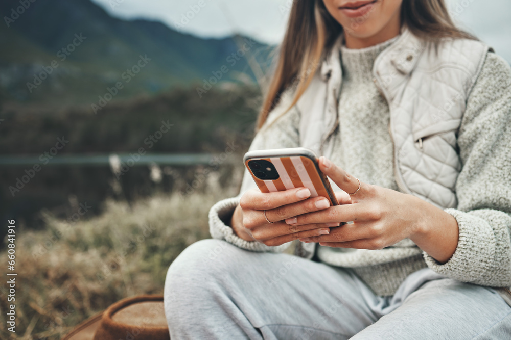 Sticker Mountain, hands and closeup of woman on a phone networking on social media, mobile app or the internet. Technology, nature and female person typing a text message on cellphone in the countryside.