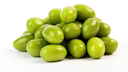 A pile of green olives on a white surface