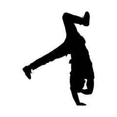 Silhouette of a male dancer doing hand stand pose. Silhouette of a man dancing pose.