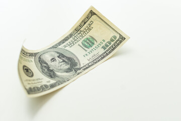 Close up hundred dollar banknote on white background