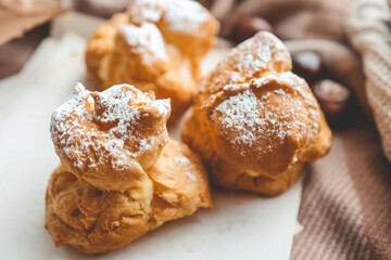 Freshly baked choux pastries close up