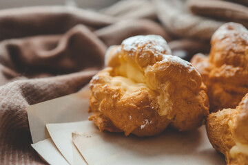 Freshly baked choux pastries close up