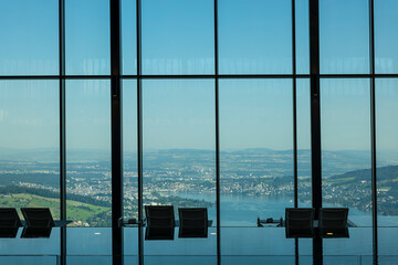 Infinity Swimming Pool with Window View over City and Lake Lucerne in Sunny Day in Lucerne, Switzerland.
