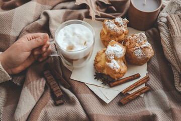 Cup of coffee in hands, cozy autumn