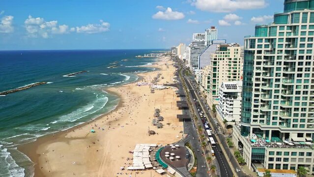 Tel Aviv, Israel, September 20, 2023. View from a drone of the Tel Aviv embankment, people swimming in the sea and playing sports. High quality 4k footage