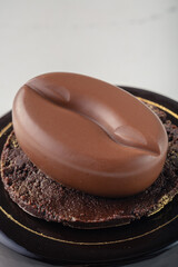 Fine French dessert and cakes on bright and white background. Petite Gateau and Entremet cakes. Well decorated celebration cakes. 