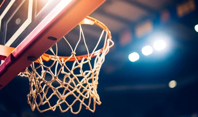 Fotobehang Detail of basket ball being dunk into the basketball net. © Jan