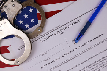 District court Notice of the lawsuit and request to waive service of a summons. Papers with...