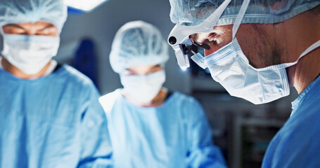 Surgery, hospital and doctor with face mask for operation, medical emergency and service in...