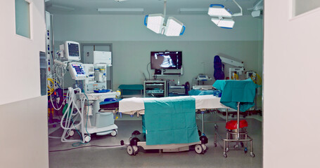Empty hospital, medical and operation room for emergency service, healing patient and interior....