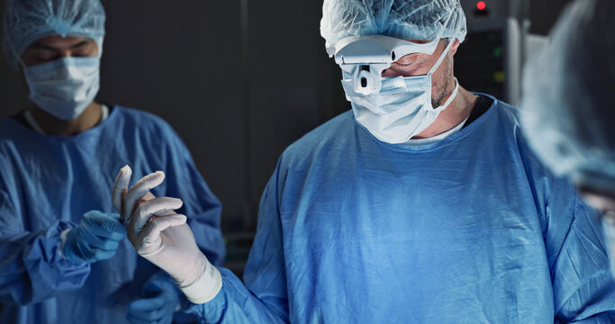 Surgery, team of doctors and scissors in operation theater, hospital and clinic. Group, medical nurse and surgeon tools in emergency room for healthcare, treatment and people working to help in ICU