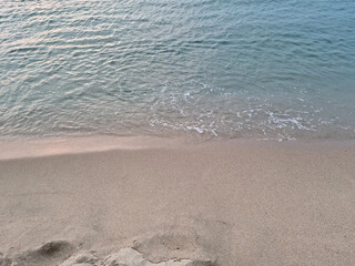 Soft beautiful ocean wave on sandy beach. Background