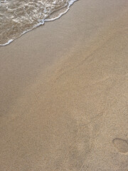 
This is a close-up of the beach sand and waves.