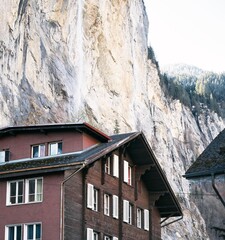 Grindelwald, Switzerland village and mountain Swiss Alps view panorama landscape, wooden chalets on...