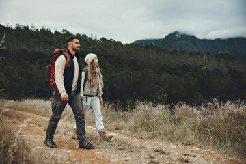 Backpack, fitness and couple hiking in nature with peace, love and bonding on forest adventure. Freedom, travel and active people outdoor walking, calm and enjoy weekend journey together on vacation