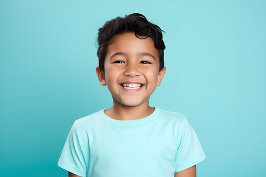 Portrait of a fictional happy little boy smiling. Isolated on a plain background. Generative AI.