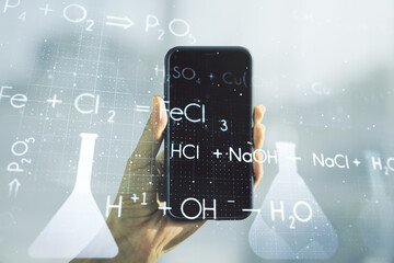 Double exposure of creative chemistry concept and hand with cell phone on background, research and development concept