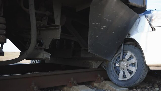 A passenger car collided with a train. The car was involved in an accident at a railway crossing. accident