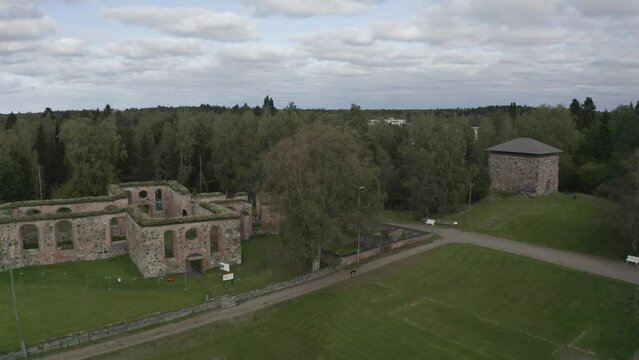 Ascending drone footage of the Ruins of Old Vaasa on a cloudy day in Kauppiaankatu, Vaasa, Finland