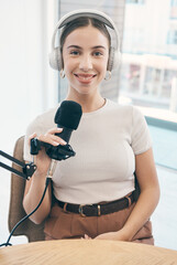 Portrait, podcast and woman with a microphone, live streaming and smile with news broadcasting....