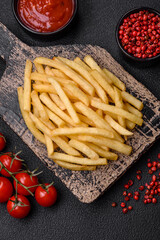 Fresh delicious crispy French fries with salt and spices