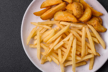 Fresh delicious crispy French fries with salt and spices