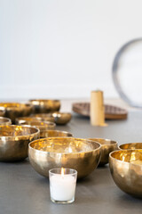 Tibetan singing bowls on the floor in a yoga studio.