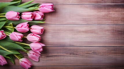 Pink tulips on old wooden background
