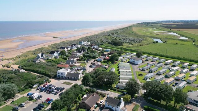 High above, video footage reveals the tranquility of Anderby Creek, a beautiful and quiet natural beach along the Lincolnshire coast in the town of Anderby.