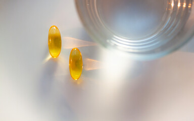 yellow translucent tablets for taking vitamins are on the table