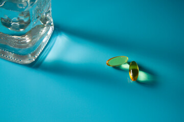 yellow translucent tablets for taking vitamins are on the table