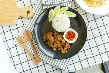 Stir-fried sliced Beef with Holy Basil on the plate.Thai famous food (Pad Kra Pao).