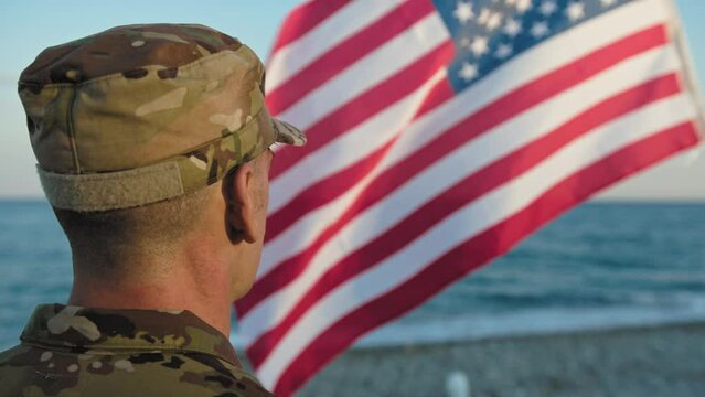 Military next to flag as patriotism concept