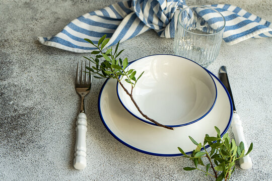 Overhead view of a rustic place setting decorated with pistachio branches