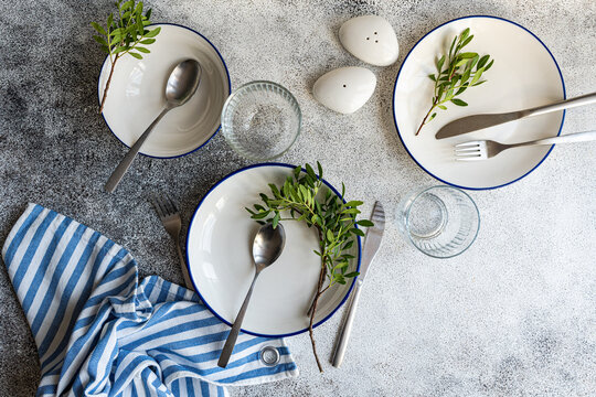 Overhead view of a rustic place setting decorated with pistachio branches