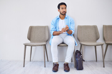 Waiting room, recruitment and man in an office for interview in job search for appointment. Hiring,...