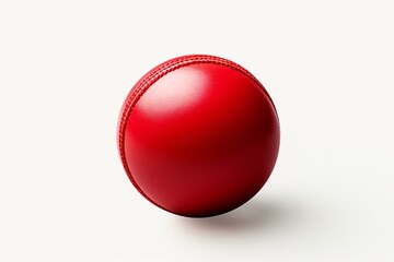 A red cricket leather ball isolated on a white background - obrazy, fototapety, plakaty